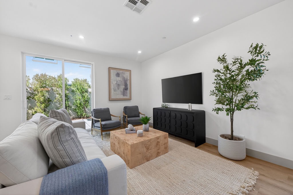 Plan B living seating area with sliding patio doors